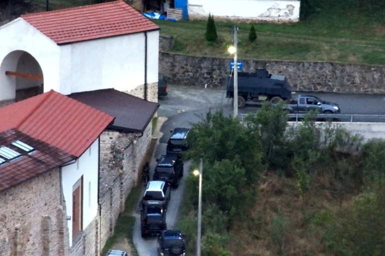A view shows unmarked vehicles lined up outside Banjska Monastery, Kosovo, in this handout picture released on September 24, 2023. Kosovo Government/Handout via REUTERS THIS IMAGE HAS BEEN SUPPLIED BY A THIRD PARTY. NO RESALES. NO ARCHIVES. MANDATORY CREDIT. BEST QUALITY AVAILABLE.