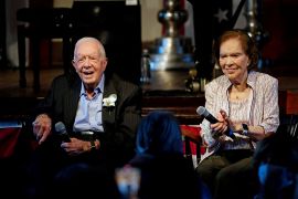FILE PHOTO: Former U.S. President Jimmy Carter and his wife, former first lady Rosalynn Carter sit together during a reception to celebrate their 75th wedding anniversary in Plains, Georgia, U.S. July 10, 2021. John Bazemore/Pool via REUTERS/File Photo