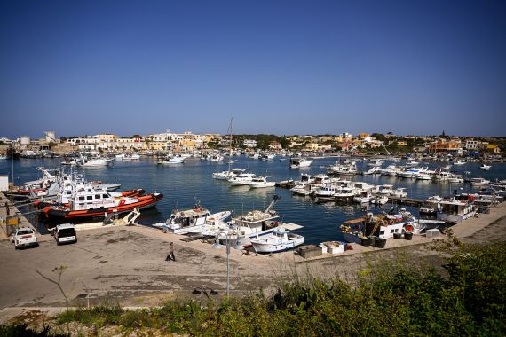 A general view shows speed boats of Italian law enforcement agency Guardia di Finanza (GdF) and of the Italian Coast Guards on June 7, 2023 in the harbour of the island of Lampedusa, south of Sicily. (Photo by Vincenzo PINTO / AFP)