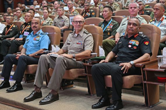 India's Chief of Army Staff General Manoj Pande (R) and his US counterpart Randy George (C) along with India's Air Chief Marshal Vivek Ram Chaudhari (L) attend the inaugural session of the 13th Indo-Pacific Armies Chiefs’ Conference (IPACC) in New Delhi on September 26, 2023. (Photo by Arun SANKAR / AFP)