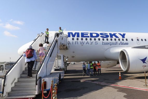 Passengers board the first flight from Tripoli to Rome on September 30, 2023 after the Italian government lifted its 10-year-old air ban on Libyan civil aviation. (Photo by Mahmud Turkia / AFP)