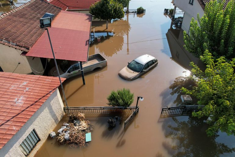Cars are submerged in a flooded area, in the aftermath of Storm Daniel, in Megala Kalyvia, Greece, September 9, 2023. REUTERS/Giannis Floulis