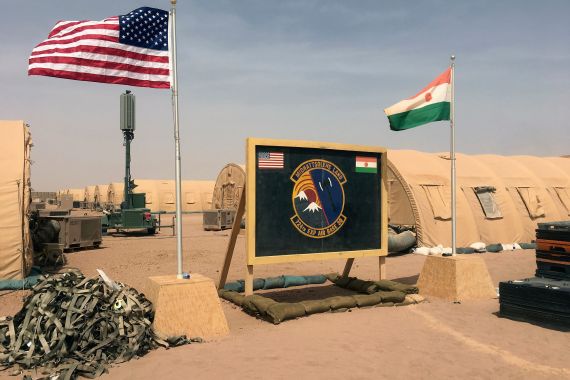 In this photo taken Monday, April 16, 2018, a U.S. and Niger flag are raised side by side at the base camp for air forces and other personnel supporting the construction of Niger Air Base 201 in Agadez, Niger. On the scorching edge of the Sahara Desert, the U.S. Air Force is building a base for armed drones, the newest front in America's battle against the growing extremist threat in Africa's vast Sahel region. Three hangars and the first layers of a runway command a sandy, barren field. Niger Air Base 201 is expected to be functional early next year. (AP Photo/Carley Petesch)
