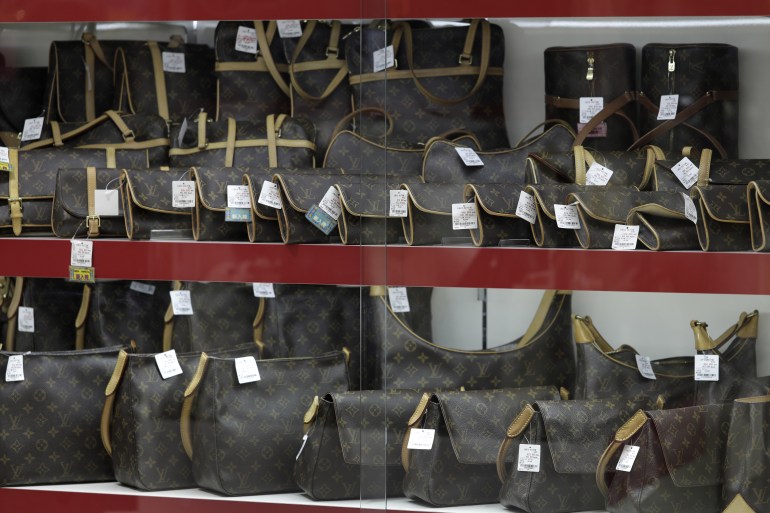 Second-hand LVMH Moet Hennessy Louis Vuitton SE wallets and handbags are displayed for sale at a Daikokuya Inc. store in the Shinjuku district of Tokyo, Japan, on Monday, March 19, 2018. Japan's resale market for luxury brand goods is worth almost 200 billion yen, according to a government report. Photographer: Kiyoshi Ota/Bloomberg via Getty Images