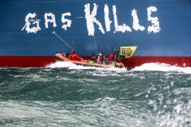 Greenpeace environmental activists on kayaks write "gas kills" on a LNG processing terminal set to be operated by Total Energies in Le Havre port, France, September 18, 2023. Jean Nicholas Guillo/Greenpeace /Handout via REUTERS THIS IMAGE HAS BEEN SUPPLIED BY A THIRD PARTY.NO RESALES. NO ARCHIVES. MANDATORY CREDIT
