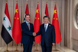 Chinese President Xi Jinping shakes hands with Syria's President Bashar al-Assad in eastern Hangzhou city, in this handout picture released by Sana on September 22, 2023, Syria. SANA/Handout via REUTERS ATTENTION EDITORS - THIS IMAGE WAS PROVIDED BY A THIRD PARTY.