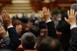 Bucharest, Romania - February 17, 2021: Shallow depth of field (selective focus) with details of Romanian MPs voting by raising their hands.; Shutterstock ID 1919379413; purchase_order: AJA; job: ; client: ; other: