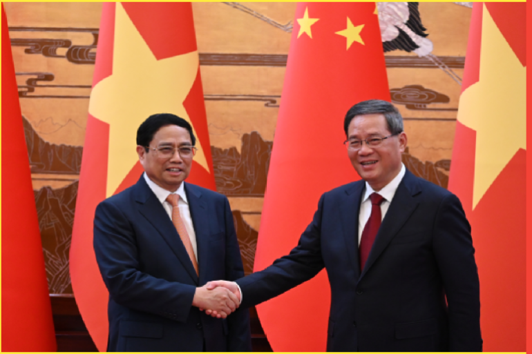 BEIJING, CHINA - JUNE 26: Vietnam's Prime Minister Pham Minh Chinh (L) shakes hands with Chinese Premier Li Qiang after a signing ceremony in the Great Hall of the People on June 26, 2023 in Beijing, China. Prime Minister Pham Minh Chinh is visiting China through the June 28th, where he will also attend the annual meeting of the World Economic Forum of the New Champions 2023, also known as the Summer Davos Forum, held in the Tianjin Municipality of northern China. (Photo by Greg Baker - Pool/Getty Images)