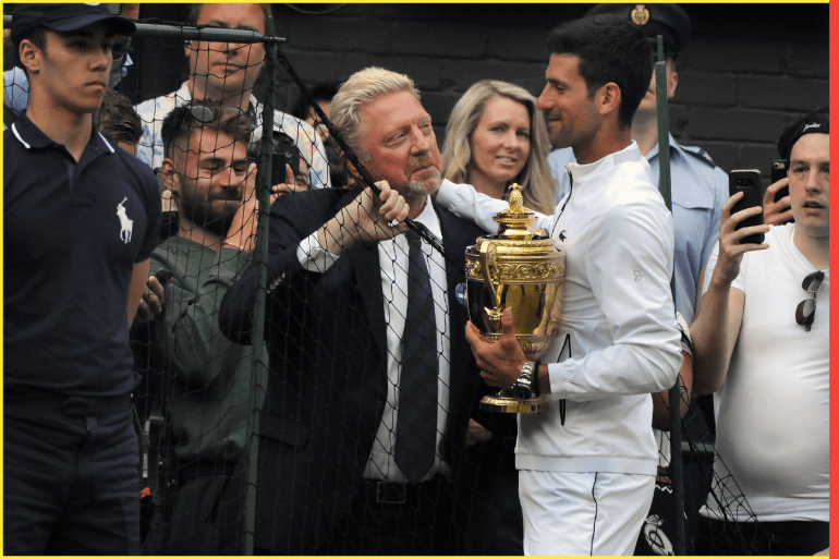 Tennis - 2019 Wimbledon Championships - Week Two, Sunday (Day Thirteen) Men's Singles, Final: Novak Djokovic (SRB) vs. Roger Federer (SUI) Boris Becker catches a quick word with winner Novak Djokovic on his lap of honour, on Centre Court. The German tennis legend is auctioning off items from his career to pay off debts he owes after being declared bankrupt two years ago. They include his US Open and Wimbledon trophies. COLORSPORT/ANDREW COWIE
