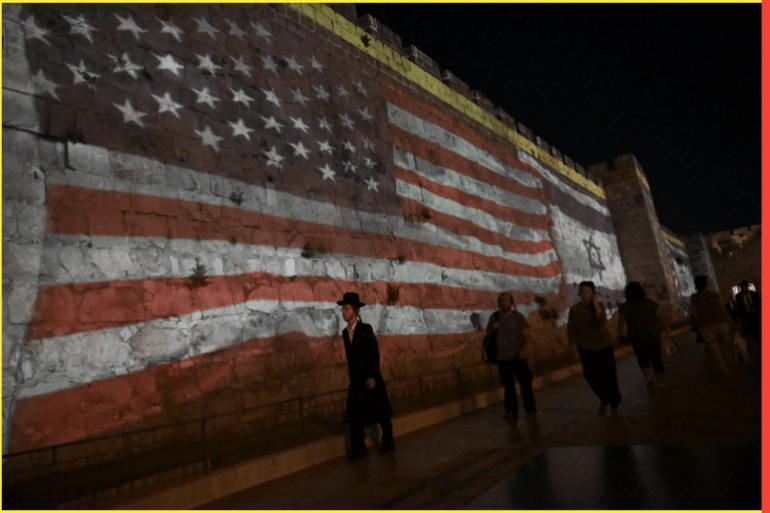 The Israeli and American flags are projected on the Old City Wall in Jerusalem during the visit of U.S. President Joe Biden, on Wednesday, July 14, 2022.