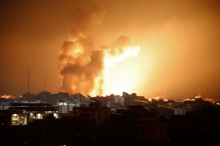 Fire and smoke rises above buildings during an Israeli air strike in Gaza City on October 8, 2023. - At least 200 Israelis died in a surprise large-scale attack by the Palestinian militant group Hamas on October 7, 2023, the army said, as Prime Minister Benjamin Netanyahu vowed to reduce the group's Gaza hideouts to "rubble". (Photo by EYAD BABA / AFP)