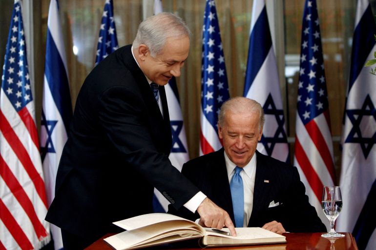 FILE PHOTO: U.S. Vice President Joe Biden (R) prepares to sign the guest book before his meeting with Israel's Prime Minister Benjamin Netanyahu at Netanyahu's residence in Jerusalem March 9, 2010. REUTERS/Ronen Zvulun/File Photo