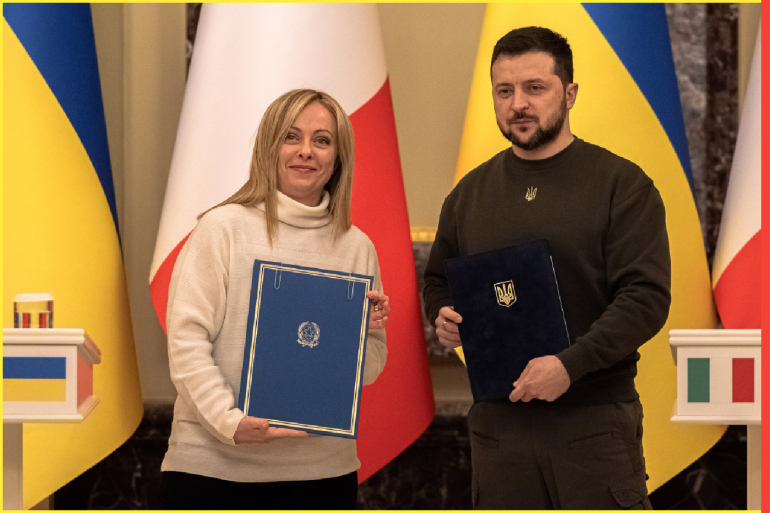 KYIV, UKRAINE - FEBRUARY 21: (EDITOR'S NOTE: Alternative crop of image #1247356214) Ukrainian President Volodymyr Zelensky and Italian Prime Minister Giorgia Meloni hold signed documents during the joint press conference following their meeting, on February 21, 2023 in Kyiv, Ukraine. Since her election last autumn, the Italian Prime Minister has shown consistent support for Ukraine in its war with Russia, despite tensions within the rightwing political alliance that brought her to power. (Photo by Roman Pilipey/Getty Images)