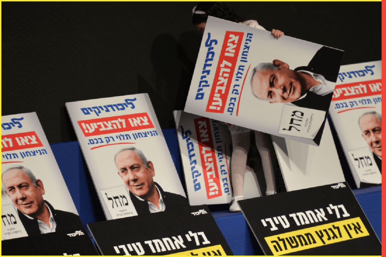A young girl prepares elections posters ahead of Israeli Prime Minister Benjamin Netanyahu arrival at a Likud party rally in Ramat Gan, ahead of the upcoming election. Israelis head to the polls for the third election in less than a year on March 2nd. On Saturday, February 29, 2020, in Ramat Gan, Tel Aviv, Israel.