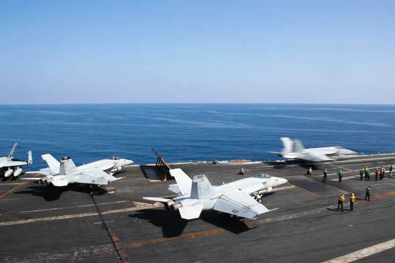 This handout picture courtesy of the US Navy released on October 15, 2203 shows an F/A-18E Super Hornet attached to the "Ragin' Bulls" of Strike Fighter Squadron (VFA) 37 launching from the flight deck of the world's largest aircraft carrier USS Gerald R. Ford (CVN) 78 in the Eastern Mediterranean Sea, October 12, 2023. - The United States said October 15, 2023 it fears an escalation of the war between Israel and Hamas and the prospect of Iran getting directly involved. In the eastern Mediterranean the carrier USS Eisenhower and its accompanying ships will join the USS Gerald R. Ford, which was dispatched after the Hamas attack on October 7. (Photo by Jackson ADKINS / US NAVY / AFP) / RESTRICTED TO EDITORIAL USE - MANDATORY CREDIT "AFP PHOTO / US NAVY / MASS COMMUNICATION SPECIALIST 2ND CLASS JACKSON ADKINS" - NO MARKETING NO ADVERTISING CAMPAIGNS - DISTRIBUTED AS A SERVICE TO CLIENTS - RESTRICTED TO EDITORIAL USE - MANDATORY CREDIT "AFP PHOTO / US NAVY / Mass Communication Specialist 2nd Class Jackson Adkins" - NO MARKETING NO ADVERTISING CAMPAIGNS - DISTRIBUTED AS A SERVICE TO CLIENTS /