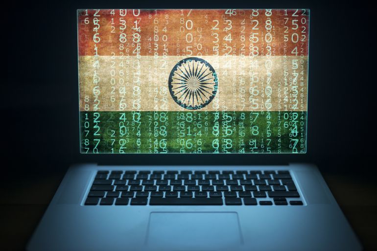 Indian hacker and computer expert. Laptop with binary computer code and India flag on the screen. Internet and network security.; Shutterstock ID 720980785; purchase_order: AJA; job: ; client: ; other: