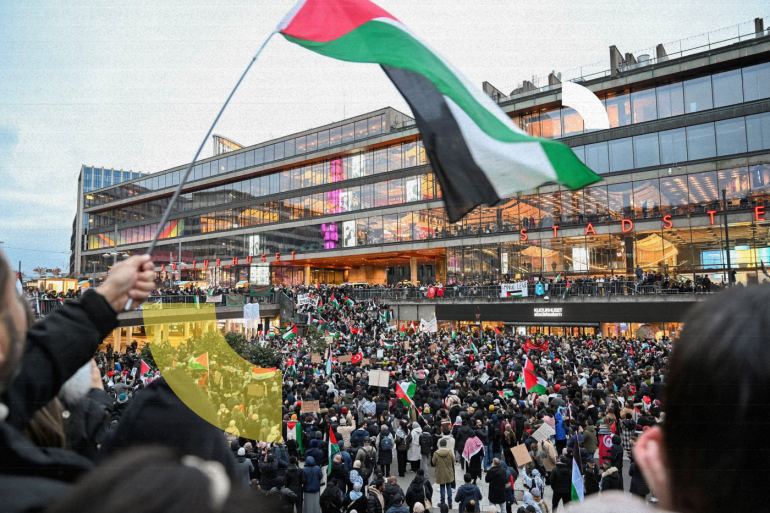 Demonstrators hold Palestinian and Turkish flags and placards during a demonstration in solidarity with Palestinians, at Sergels square in Stockholm, Sweden, October 22, 2023. TT News Agency/Pontus Lundahl via REUTERS ATTENTION EDITORS - THIS IMAGE WAS PROVIDED BY A THIRD PARTY. SWEDEN OUT. NO COMMERCIAL OR EDITORIAL SALES IN SWEDEN.
