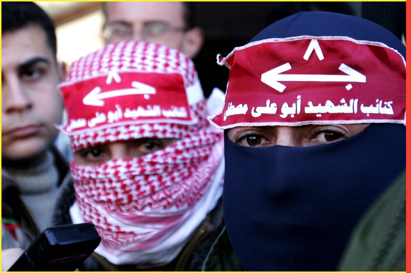 GAZA, GAZA STRIP - FEBRUARY 04: Masked gunmen attend a press conference while Abu Thaer (not pictured) a Palestinian spokesman of the Al-Aqsa Brigades the military wing of the Palestinian president Mahmoud Abbas movement Fatah, speaks to the media in Gaza City on February 4, 2008 to claim joint responsibility with Abu Ali Mustafa Brigades, a military wing of the Popular Front for the Liberation of Palestine (PFLP), for the suicide bombing at a shopping centre in the Israeli desert town of Dimona. A Palestinian suicide bomber blew himself up and police shot dead his accomplice in an attack in a shopping centre in southern Israel on Monday that killed at least one Israeli, emergency services said. (Photo by Abid Katib/Getty Images)