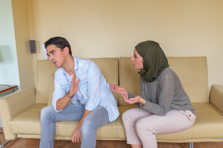 A Young Man is Ignoring his Girlfriend of Middle Eastern Ethnicity During a Serious Arguing They Have.