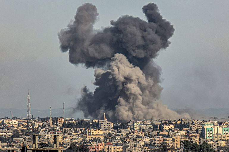 Smoke billows from Israeli bombardment over Khan Yunis from Rafah in the southern Gaza Strip on December 16, 2023, amid ongoing battles between Israel and the Palestinian militant group Hamas. (Photo by SAID KHATIB / AFP)