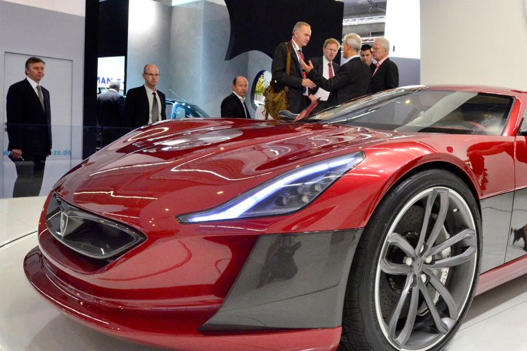 A model poses next to an electric sportscar of Croatian car producer Rimac Automobili at the international motor show IAA (Internationale Automobil-Ausstellung) in Frankfurt/M, western Germany, on September 14, 2011. The world's biggest motor show, the IAA, is running from September 15 to 25, 2011. AFP PHOTO / THOMAS KIENZLE (Photo by THOMAS KIENZLE / AFP) RELATED CONTENT PHOTOS germany - economy - auto - sector - show - iaa germany - economy - auto - sector - show - iaa germany - economy - auto - sector - show - iaa People walk past a display with the perfect electric car at the international motor show IAA (Internationale Automobil-Ausstellung) in Frankfurt/M, western Germany, on September 14, 2011. germany - economy - auto - sector - show - iaa germany - economy - auto - sector - show - iaa A Mercedes SLS AMG roadster car is on display at the international motor show IAA (Internationale Automobil-Ausstellung) in Frankfurt/M, western Germany, on September 14, 2011. germany - economy - auto - sector - show - iaa germany - economy - auto - sector - show - iaa A Mercedes F 125 Concept fuel cell hybrid car is on display at the international motor show IAA (Internationale Automobil-Ausstellung) in Frankfurt/M, western Germany, on September 14, 2011. germany - economy - auto - sector - show - iaa - merkel germany - economy - auto - sector - show - iaa - ramsauer germany - economy - auto - sector - show - iaa - ramsauer German Transport Minister Peter Ramsauer looks on during the opening of the international Frankfurt motor show IAA (Internationale Automobil-Ausstellung) in Frankfurt/M., western Germany, on September 15, 2011. germany - economy - auto - sector - show - iaa - ramsauer germany - economy - auto - sector - show - iaa - ramsauer German Transport Minister Peter Ramsauer (C) looks on as German Chancellor Angela Merkel (R) chats with Dieter Zetsche (L), CEO of German car maker Daimler AG, and Hesse's state premier Volker Bouffier (2nd R) during her tour to open the international Frankfurt motor show IAA (Internationale Automobil-Ausstellung) in Frankfurt/M., western Germany, on September 15, 2011. germany - economy - auto - sector - show - iaa - merkel German Chancellor Angela Merkel talks with Dieter Zetsche (L), CEO of German car maker Daimler AG, as German Transport Minister Peter Ramsauer (2nd L) and Hesse's state premier Volker Bouffier (R, hidden) look on during her tour to open the international Frankfurt motor show IAA (Internationale Automobil-Ausstellung) in Frankfurt/M., western Germany, on September 15, 2011. germany - economy - auto - sector - show - iaa - merkel germany - economy - auto - sector - show - iaa - merkel germany - economy - auto - sector - show - iaa - merkel germany - economy - auto - sector - show - iaa - merkel germany - economy - auto - sector - show - iaa - merkel germany - economy - auto - sector - show - iaa - merkel German Chancellor Angela Merkel and Dieter Zetsche, CEO of German car maker Daimler AG, stand next to a Mercedes F 125 Concept fuel cell hybrid car during Merkel's tour to open the international Frankfurt motor show IAA (Internationale Automobil-Ausstellung) in Frankfurt/M., western Germany, on September 15, 2011. germany - economy - auto - sector - show - iaa Hesse's state premier Volker Bouffier inspects a Mercedes F 125 Concept fuel cell hybrid car by German car maker Daimler AG during the international Frankfurt motor show IAA (Internationale Automobil-Ausstellung) in Frankfurt/M., western Germany, on September 15, 2011. germany - economy - auto - sector - show - iaa - merkel German Chancellor Angela Merkel listens to Dieter Zetsche, CEO of German car maker Daimler AG, during her tour to open the international Frankfurt motor show IAA (Internationale Automobil-Ausstellung) in Frankfurt/M., western Germany, on September 15, 2011. germany - economy - auto - sector - show - iaa - merkel German Chancellor Angela Merkel listens to Dieter Zetsche, CEO of German car maker Daimler AG, during her tour to open the international Frankfurt motor show IAA (Internationale Automobil-Ausstellung) in Frankfurt/M., western Germany, on September 15, 2011. germany - economy - auto - sector - show - iaa - merkel germany - economy - auto - sector - show - iaa - merkel germany - economy - auto - sector - show - iaa - merkel German Chancellor Angela Merkel sits in a Volkswagen up! germany - economy - auto - sector - show - iaa - merkel German Chancellor Angela Merkel inspects a Volkswagen up! germany - economy - auto - sector - show - iaa - merkel germany - economy - auto - sector - show - iaa - merkel German Chancellor Angela Merkel listens to Rupert Stadler, CEO of German car maker Audi, during her tour to open the international Frankfurt motor show IAA (Internationale Automobil-Ausstellung) in Frankfurt/M., western Germany, on September 15, 2011. germany - economy - auto - sector - show - iaa - merkel germany - economy - auto - sector - show - iaa - merkel germany - economy - auto - sector - show - iaa - merkel German Chancellor Angela Merkel stands next to Dieter Zetsche, CEO of German car maker Daimler AG, as she visits the company's booth during her tour to open the international Frankfurt motor show IAA (Internationale Automobil-Ausstellung) in Frankfurt/M., western Germany, on September 15, 2011. germany - economy - auto - sector - show - iaa - merkel German Chancellor Angela Merkel stands next to Dieter Zetsche, CEO of German car maker Daimler AG, and a new Mercedes car as she visits the company's booth during her tour to open the international Frankfurt motor show IAA (Internationale Automobil-Ausstellung) in Frankfurt/M., western Germany, on September 15, 2011. germany - economy - auto - sector - show - iaa An Audi A2 electric concept car is on display at the international motor show IAA (Internationale Automobil-Ausstellung) in Frankfurt/M, western Germany, on September 14, 2011. germany - economy - auto - sector - show - iaa - merkel germany - economy - auto - sector - show - iaa - merkel germany - economy - auto - sector - show - iaa - merkel German Chancellor Angela Merkel sits in a Volkswagen up! germany - economy - auto - sector - show - iaa - merkel German Chancellor Angela Merkel gets off a Volkswagen up! germany - economy - auto - sector - show - iaa germany - economy - auto - sector - show - iaa - merkel German Chancellor Angela Merkel gets off a Volkswagen up! germany - economy - auto - sector - show - iaa germany - economy - auto - sector - show - iaa People look at Audi cars are on display at the international motor show IAA (Internationale Automobil-Ausstellung) in Frankfurt/M, western Germany, on September 14, 2011. germany - economy - auto - sector - show - iaa - merkel German Chancellor Angela Merkel (L) is helped by Martin Winterkorn, CEO of German car maker Volkswagen (VW), to get off a car as she visits the company's booth during her tour to open the international Frankfurt motor show IAA (Internationale Automobil-Ausstellung) in Frankfurt/M., western Germany, on September 15, 2011. germany - economy - auto - sector - show - iaa - merkel German Chancellor Angela Merkel (L) sits in a Volkswagen up! germany - economy - auto - sector - show - iaa People look at Audi cars on display at the international motor show IAA (Internationale Automobil-Ausstellung) in Frankfurt/M, western Germany, on September 14, 2011. germany - economy - auto - sector - show - iaa - merkel German Chancellor Angela Merkel (L) is given some explanations by Martin Winterkorn, CEO of German car maker Volkswagen (VW), as she visits the company's booth during her tour to open the international Frankfurt motor show IAA (Internationale Automobil-Ausstellung) in Frankfurt/M., western Germany, on September 15, 2011. germany - economy - auto - sector - show - iaa - merkel germany - economy - auto - sector - show - iaa - merkel germany - economy - auto - sector - show - iaa - merkel German Chancellor Angela Merkel visits the booth of German luxury car maker BMW during her tour to open the international Frankfurt motor show IAA (Internationale Automobil-Ausstellung) in Frankfurt/M., western Germany, on September 15, 2011. germany - economy - auto - sector - show - iaa - merkel German Chancellor Angela Merkel sits in a BMW i3 Concept Car besides Norbert Reithofer (R), chairman of German luxury car maker BMW, during her tour to open the international Frankfurt motor show IAA (Internationale Automobil-Ausstellung) in Frankfurt/M., western Germany, on September 15, 2011. germany - economy - auto - sector - show - iaa - merkel germany - economy - auto - sector - show - iaa - merkel germany - economy - auto - sector - show - iaa - merkel German Chancellor Angela Merkel is assisted by Norbert Reithofer (hidden), chairman of German luxury car maker BMW, as she enters a BMW i3 Concept Car during her tour to open the international Frankfurt motor show IAA (Internationale Automobil-Ausstellung) in Frankfurt/M., western Germany, on September 15, 2011. germany - economy - auto - sector - show - iaa - merkel germany - economy - auto - sector - show - iaa germany - economy - auto - sector - show - iaa A 4C concept car of Alfa Romeo is seen at the international motor show IAA (Internationale Automobil-Ausstellung) in Frankfurt/M, western Germany, on September 14, 2011. germany - economy - auto - sector - show - iaa A 4C concept car of Alfa Romeo is seen at the international motor show IAA (Internationale Automobil-Ausstellung) in Frankfurt/M, western Germany, on September 14, 2011. germany - economy - auto - sector - show - iaa A Maserati GranTourismo is on display during the international motor show IAA (Internationale Automobil-Ausstellung) in Frankfurt/M, western Germany, on September 14, 2011. germany - economy - auto - sector - show - iaa A Maserati GranTourismo is on display during the international motor show IAA (Internationale Automobil-Ausstellung) in Frankfurt/M, western Germany, on September 14, 2011. germany - economy - auto - sector - show - iaa germany - economy - auto - sector - show - iaa The logo of carmaker Renault is seen during the international motor show IAA (Internationale Automobil-Ausstellung) in Frankfurt/M, western Germany, on September 14, 2011. germany - economy - auto - sector - show - iaa The logo of carmaker Mercedes-Benz is seen during the international motor show IAA (Internationale Automobil-Ausstellung) in Frankfurt/M, western Germany, on September 14, 2011. germany - economy - auto - sector - show - iaa germany - economy - auto - sector - show - iaa germany - economy - auto - sector - show - iaa The logo of carmaker Infiniti is seen during the international motor show IAA (Internationale Automobil-Ausstellung) in Frankfurt/M, western Germany, on September 14, 2011. germany - economy - auto - sector - show - iaa germany - economy - auto - sector - show - iaa germany - economy - auto - sector - show - iaa A Lamborghini Aventator is seen at the booth of Bugatti during the international motor show IAA (Internationale Automobil-Ausstellung) in Frankfurt/M, western Germany, on September 14, 2011. germany - economy - auto - sector - show - iaa A Lamborghini Aventator is seen at the booth of Bugatti during the international motor show IAA (Internationale Automobil-Ausstellung) in Frankfurt/M, western Germany, on September 14, 2011. germany - economy - auto - sector - show - iaa germany - economy - auto - sector - show - iaa germany - economy - auto - sector - show - iaa A Bugatti Veyron is seen at the booth of Bugatti during the international motor show IAA (Internationale Automobil-Ausstellung) in Frankfurt/M, western Germany, on September 14, 2011. germany - economy - auto - sector - show - iaa germany - economy - auto - sector - show - iaa The logo of carmaker Alfa Romeo is pictured during the international motor show IAA (Internationale Automobil-Ausstellung) in Frankfurt/M, western Germany, on September 14, 2011. germany - economy - auto - sector - show - iaa germany - economy - auto - sector - show - iaa germany - economy - auto - sector - show - iaa germany - economy - auto - sector - show - iaa germany - economy - auto - sector - show - iaa germany - economy - auto - sector - show - iaa germany - economy - auto - sector - show - iaa The logo of carmaker Citroen is pictured during the international motor show IAA (Internationale Automobil-Ausstellung) in Frankfurt/M, western Germany, on September 14, 2011. germany - economy - auto - sector - show - iaa germany - economy - auto - sector - show - iaa The logo of carmaker Peugeot is pictured during the international motor show IAA (Internationale Automobil-Ausstellung) in Frankfurt/M, western Germany, on September 14, 2011. germany - economy - auto - sector - show - iaa germany - economy - auto - sector - show - iaa germany - economy - auto - sector - show - iaa The logo of carmaker Volvo is pictured during the international motor show IAA (Internationale Automobil-Ausstellung) in Frankfurt/M, western Germany, on September 14, 2011. germany - economy - auto - sector - show - iaa germany - economy - auto - sector - show - iaa germany - economy - auto - sector - show - iaa - vw Visitors walk around at the booth of German car maker Volkswagen (VW) during the international motor show IAA (Internationale Automobil-Ausstellung) in Frankfurt/M, western Germany, on September 14, 2011. germany - economy - auto - sector - show - iaa - opel germany - economy - auto - sector - show - iaa - opel germany - economy - auto - sector - show - iaa - opel germany - economy - auto - sector - show - iaa - opel germany - economy - auto - sector - show - iaa - opel A new Opel Ampera is seen at the booth of Opel during the international motor show IAA (Internationale Automobil-Ausstellung) in Frankfurt/M, western Germany, on September 14, 2011. germany - economy - auto - sector - show - iaa - opel A new Opel Ampera is seen at the booth of Opel during the international motor show IAA (Internationale Automobil-Ausstellung) in Frankfurt/M, western Germany, on September 14, 2011. germany - economy - auto - sector - show - iaa - opel germany - economy - auto - sector - show - iaa - fiat germany - economy - auto - sector - show - iaa - fiat germany - economy - auto - sector - show - iaa germany - economy - auto - sector - show - iaa Visitors walk around at the booth of German car maker BMW during the international motor show IAA (Internationale Automobil-Ausstellung) in Frankfurt/M, western Germany, on September 14, 2011. germany - economy - auto - sector - show - iaa - bmw