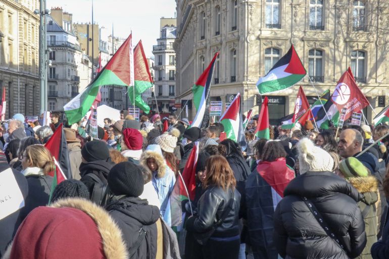 PARIS, FRANCE - JANUARY 20: People, holding banners and Palestinian flags, gather to join a Pro-Palestinian march from Republic Square Paris towards European Council in Brussels to protest against Israeli attacks over Gaza, on January 20, 2024 in Paris, France. ( Ümit Dönmez - Anadolu Agency )
