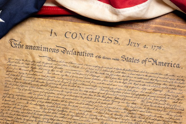United States Declaration of Independence with a vintage American flag; Shutterstock ID 1669305349; purchase_order: AJA; job: ; client: ; other:
