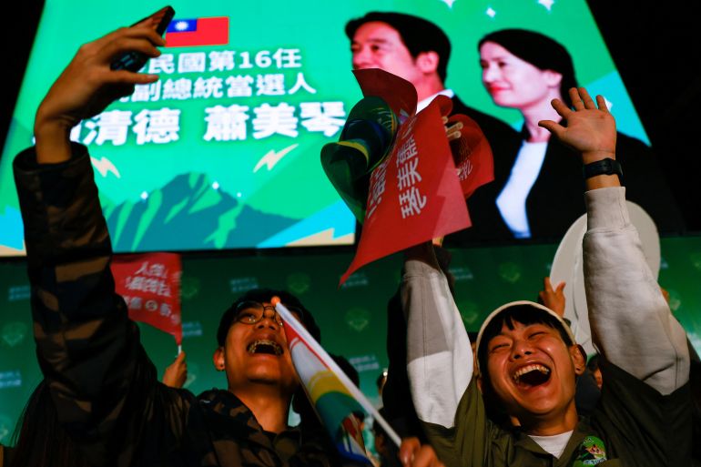 Supporters of the Democratic Progressive Party (DPP) celebrate during a rally, following the victory of Lai Ching-te in the presidential elections, in Taipei, Taiwan January 13, 2024. REUTERS/Ann Wang