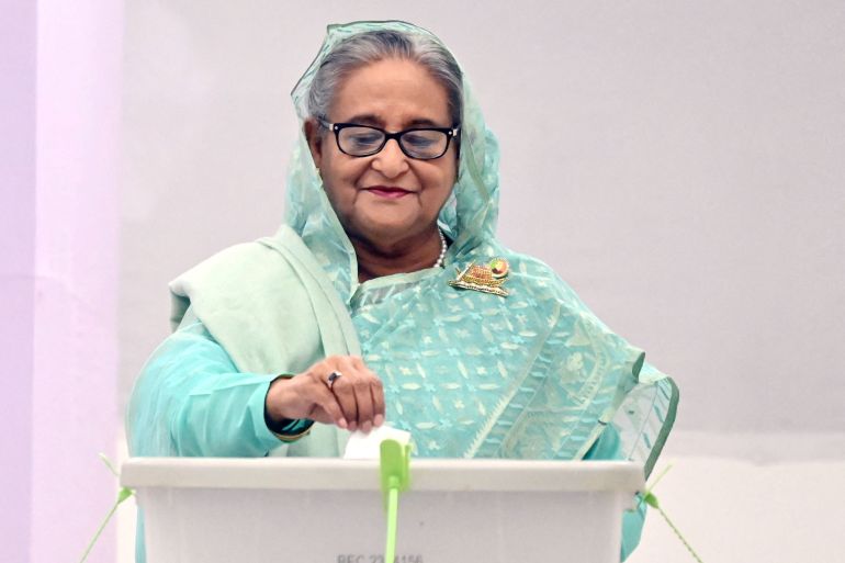 Sheikh Hasina, Prime Minister of Bangladesh and Chairperson of Bangladesh Awami League puts ballot paper inside the ballot box after casting her vote at the Dhaka City College center during the 12th general election in Dhaka, Bangladesh, January 7, 2024. Prime Minister's office/Handout via REUTERS THIS IMAGE HAS BEEN SUPPLIED BY A THIRD PARTY NO RESALES. NO ARCHIVES