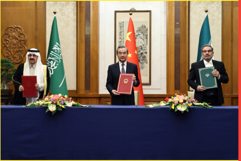 Wang Yi, a member of the Political Bureau of the Communist Party of China (CPC) Central Committee and director of the Office of the Central Foreign Affairs Commission attends a meeting with Secretary of Iran's Supreme National Security Council Ali Shamkhani and Minister of State and national security adviser of Saudi Arabia Musaad bin Mohammed Al Aiban in Beijing, China March 10, 2023. China Daily via REUTERS ATTENTION EDITORS - THIS IMAGE WAS PROVIDED BY A THIRD PARTY. CHINA OUT.
