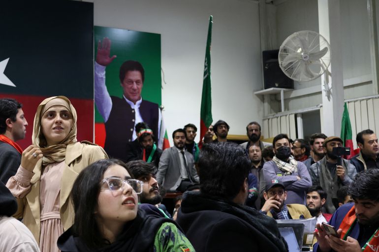 Volunteers for former Prime Minister Imran Khan's party Pakistan Tehreek-e-Insaf (PTI) look on as they watch results on TV screens after the end of the polling during a general election at the party's main office in Islamabad, Pakistan, February 8, 2024. REUTERS/Charlotte Greenfield