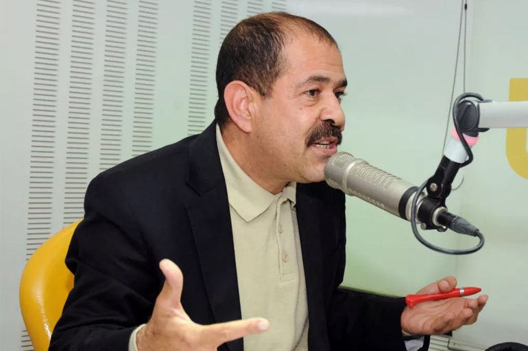 A picture taken on November 20, 2012 shows Tunisian lawyer and opposition leader Chokri Belaid speaking during a radio interview in Tunis. Chokri Belaid, who was gunned down outside his home on February 6, was a fierce opponent of Tunisia's ruling Islamists and a pan-Arab, left-wing activist propelled to the front of the political scene after the revolution. AFP PHOTO / KHALIL (Photo credit should read KHALIL/AFP via Getty Images)