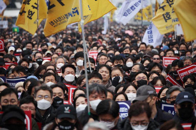 Doctors take part in a rally to protest against government plans to increase medical school admissions in Seoul, South Korea, March 3, 2024. REUTERS/Kim Hong-Ji