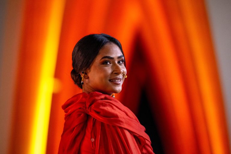 In this handout picture released by El Gouna Film Festival, Sudanese actress Eiman Yousif arrives to the screening of Sudanese movie 'Goodbye Julia' as part of the festival's sixth edition in Egypt's El Gouna on December 16, 2023. (Photo by Ammar Abd RABBO / El Gouna Film Festival / AFP) / RESTRICTED TO EDITORIAL USE - MANDATORY CREDIT "AFP PHOTO /EL GOUNA FILM FESTIVAL" - NO MARKETING - NO ADVERTISING CAMPAIGNS - DISTRIBUTED AS A SERVICE TO CLIENTS - RESTRICTED TO EDITORIAL USE - MANDATORY CREDIT "AFP PHOTO /EL GOUNA FILM FESTIVAL" - NO MARKETING - NO ADVERTISING CAMPAIGNS - DISTRIBUTED AS A SERVICE TO CLIENTS /