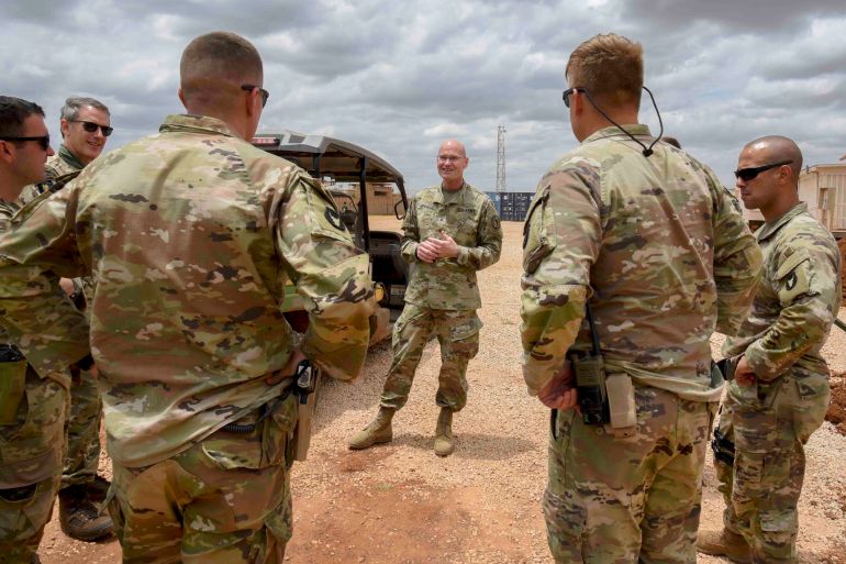 U.S. Army Brig. Gen. Damian T. Donahoe, deputy commanding general, Combined Joint Task Force - Horn of Africa, center, talks with service members during a battlefield circulation Saturday, Sept. 5, 2020, in Somalia. No country has been involved in Somalia's future as much as the United States but now the Trump administration is thinking of withdrawing the several hundred U.S. military troops from the nation at what some experts call the worst possible time. (Senior Airman Kristin Savage/Combined Joint Task Force - Horn of Africa via AP)