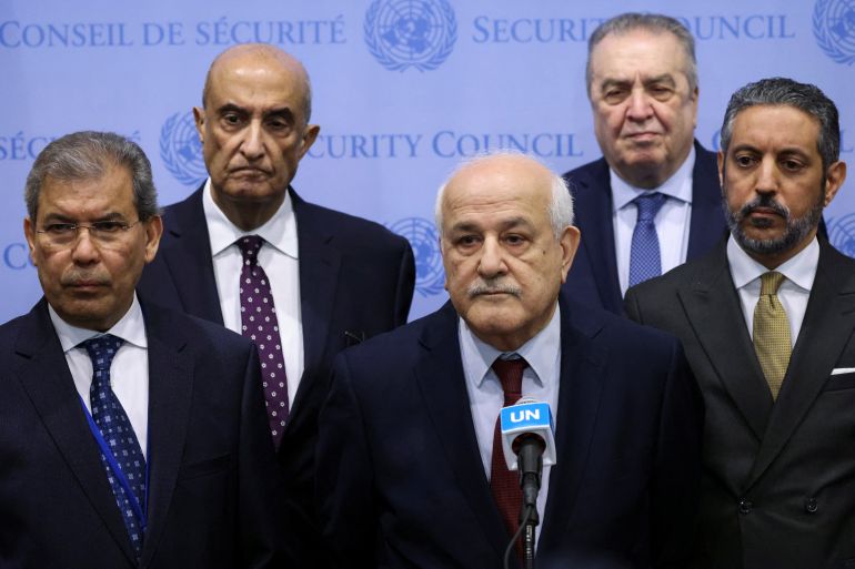 Palestinian Ambassador to the United Nations Riyad Mansour speaks with the media accompanied by Yemen's Ambassador to the United Nations Abdullah Ali Fadhel Al-Saadi and Algeria's Representative to the United Nations Amar Bendjama following a meeting of the Security Council to vote on a Gaza resolution that demands an immediate ceasefire for the month of Ramadan leading to a permanent sustainable ceasefire, and the immediate and unconditional release of all hostages, at U.N. headquarters in New York City, U.S., March 25, 2024. REUTERS/Andrew Kelly