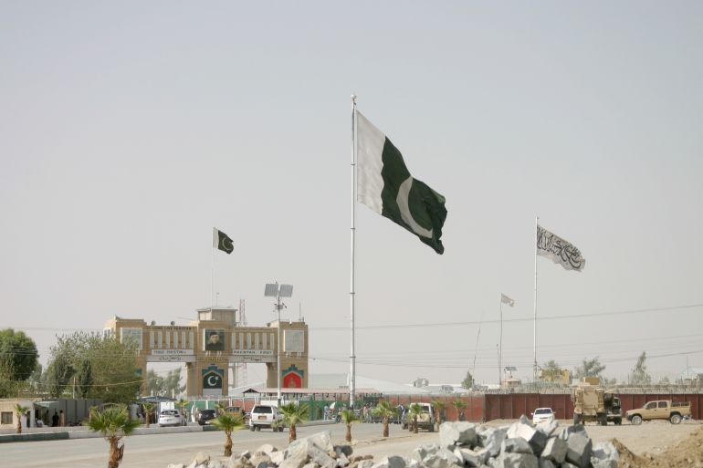 General view of Pakistan and Taliban flags at the Friendship Gate crossing point in the Pakistan-Afghanistan border town of Chaman, Pakistan August 27, 2021. REUTERS/Saeed Ali Achakzai