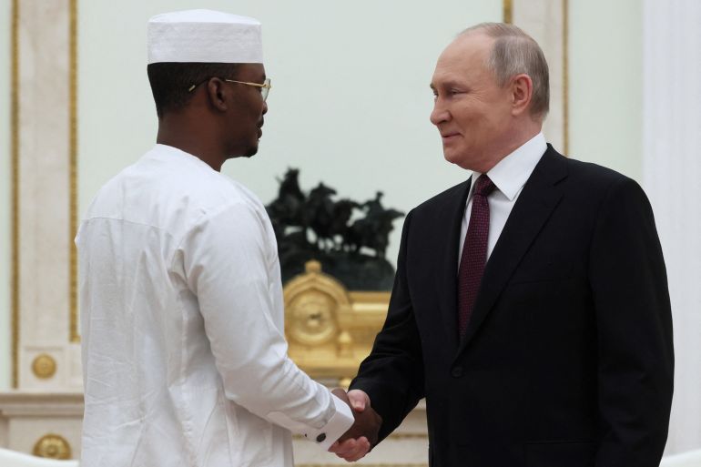 Russia's President Vladimir Putin shakes hands with Chad's interim President Mahamat Idriss Deby during a meeting at the Kremlin in Moscow, Russia January 24, 2024. Sputnik/Mikhail Metzel/Pool via REUTERS ATTENTION EDITORS - THIS IMAGE WAS PROVIDED BY A THIRD PARTY.