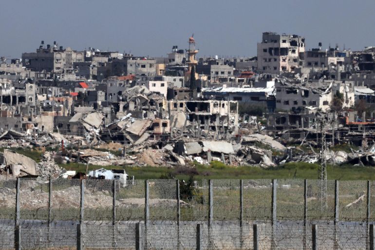 This picture taken on March 28, 2024 from Israel's southern border with the Gaza Strip shows buildings which have been destroyed by Israeli strikes, amid the ongoing battles between Israeli forces and Hamas militants since the October 7 attack on southern Israel. (Photo by JACK GUEZ / AFP)