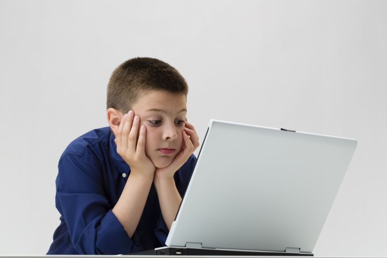 Boy looking in computer screen