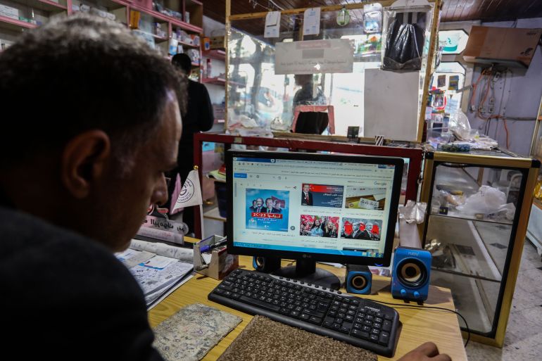 Palestinians watch the Turkish elections on television and social media in the city of Rafah, in the southern Gaza Strip, on May 15, 2023.