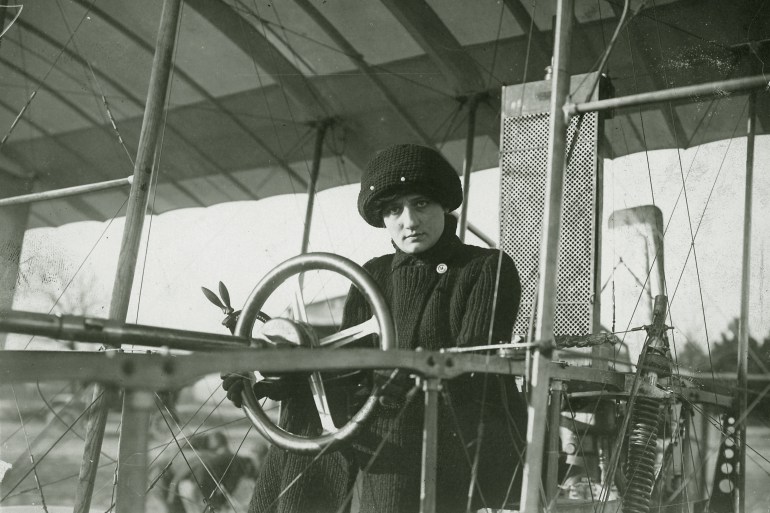 Elise Deroche, the first certified female air pilot, sits at the wheel of a Voisin biplane. She flew under the assumed name of Baroness Raymonde de Laroche. (Photo by Canada Aviation & Space Museum/Corbis via Getty Images)
