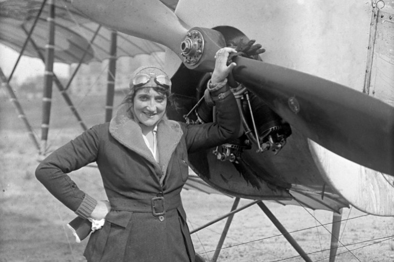 (Original Caption) 7/1919- Portrait of famous French aviatrix Baroness de la Roche, who was killed Friday when the plane she was flying at Crotoy, France collapsed. This photo of the Baroness was made two weeks ago after she broke the world's record for altitude reached by a woman, formerly held by Ruth Law. The Baroness is shown standing in front of the machine in which she was killed. She was the world's first woman flier, having won her pilot's license in 1910.
