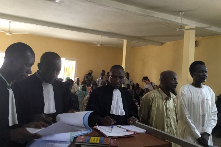 Members of the Military Command Council for the Salvation of the Republic Ahmat Yacoub Adam (R) and Hassan Boulmaye (2nd R) stand in N'djamena court for the verdict in their trial on June 6, 2019. Two leaders of a major Chadian rebel group were sentenced on June 6, 2019 in N'Djamena to life imprisonment for participating in "insurrectional movements". (Photo by Djimet WICHE / AFP)