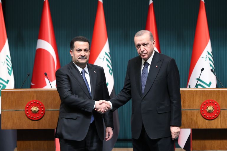 President Recep Tayyip Erdoğan (R) shakes hands with Iraqi Prime Minister Mohammed S. Al Sudani during a meeting in the capital Ankara, Türkiye, March 22, 2023. (DHA Photo)