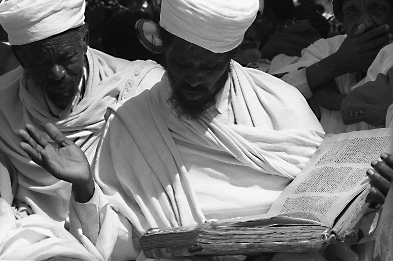 An elderly Ethiopian Jew, or "Falasha" recites prayers from his Amharic bible during a demonstration held on Rosh Hashana, the Jewish New Year, 11 September, 1985. One year after being rescued in "Operation Moses" - a secret airlift from the famine stricken Horn of Africa, the black Jews of Ethiopia still face formidable obstacles adapting to life in Israel. REUTERS/Havakuk Levison (ISRAEL)