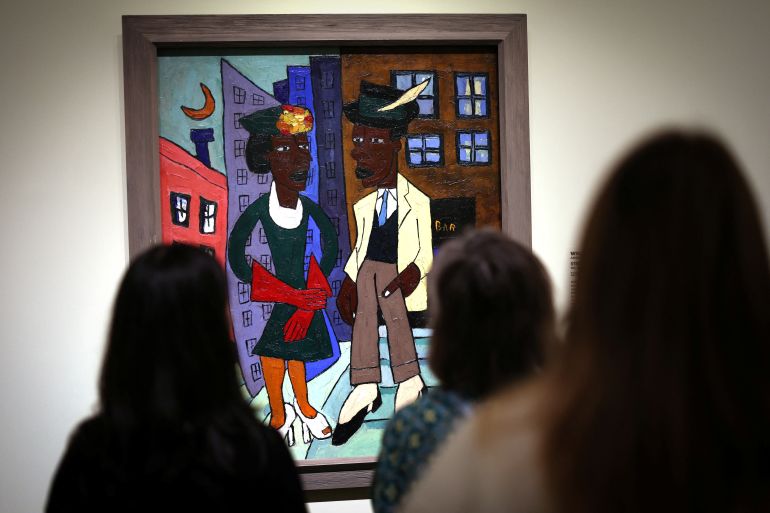 People view William H. Johnson’s painting “Street Life, Harlem” (ca.1939-40) during a preview of a new exhibition focusing on the Harlem Renaissance “The Harlem Renaissance and Transatlantic Modernism” at the Metropolitan Museum of Art in New York City, U.S., February 22, 2024. REUTERS/Mike Segar