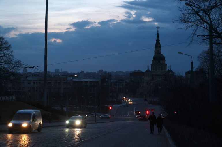 KHARKIV, UKRAINE - MARCH 24, 2024 - Cars move along a dark street as the city experiences power outages after a Russian missile and drone attack on Kharkiv's power system, with the power supply restored to 40 per cent of households in Kharkiv. (Photo credit should read Vyacheslav Madiyevskyy / Ukrinform/Future Publishing via Getty Images)