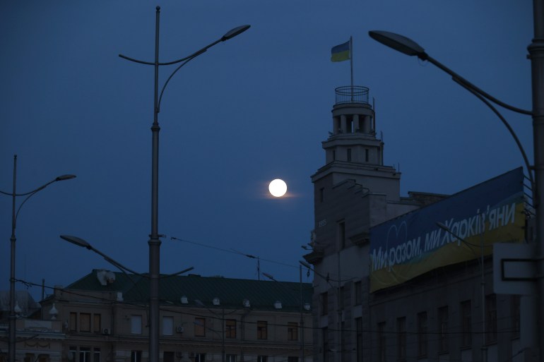 KHARKIV, UKRAINE - MARCH 24, 2024 - The moon shines in the sky as the city experiences power outages after a Russian missile and drone attack on Kharkiv's power system, with the power supply restored to 40 per cent of households in Kharkiv. (Photo credit should read Vyacheslav Madiyevskyy / Ukrinform/Future Publishing via Getty Images)