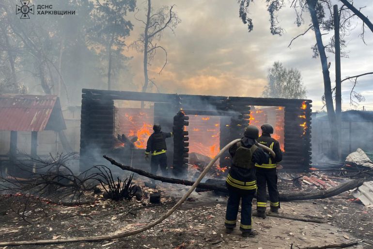 This handout photograph taken and released by the Ukrainian Emergency Service on April 21, 2024 shows firefighters putting out a fire after a strike in Kherson, amid the Russian invasion on Ukraine. (Photo by Handout / UKRAINIAN EMERGENCY SERVICE / AFP) / RESTRICTED TO EDITORIAL USE - MANDATORY CREDIT "AFP PHOTO / Ukrainian Emergency Service " - NO MARKETING NO ADVERTISING CAMPAIGNS - DISTRIBUTED AS A SERVICE TO CLIENTS